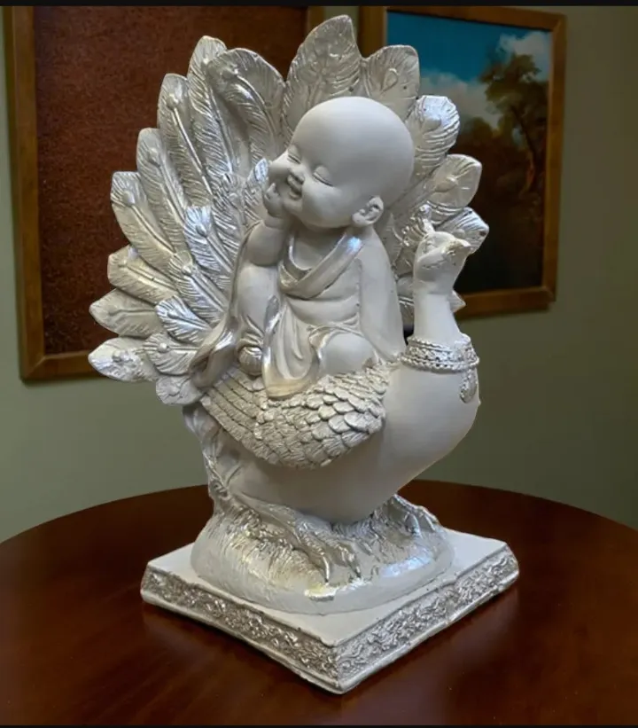Smiling Baby Buddha with Peacock – Spiritual Resin Decorative Idol